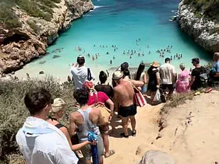 German Owners of Mallorca Beach Seek Access Restrictions as Viral Hotspot Struggles with Overcrowding