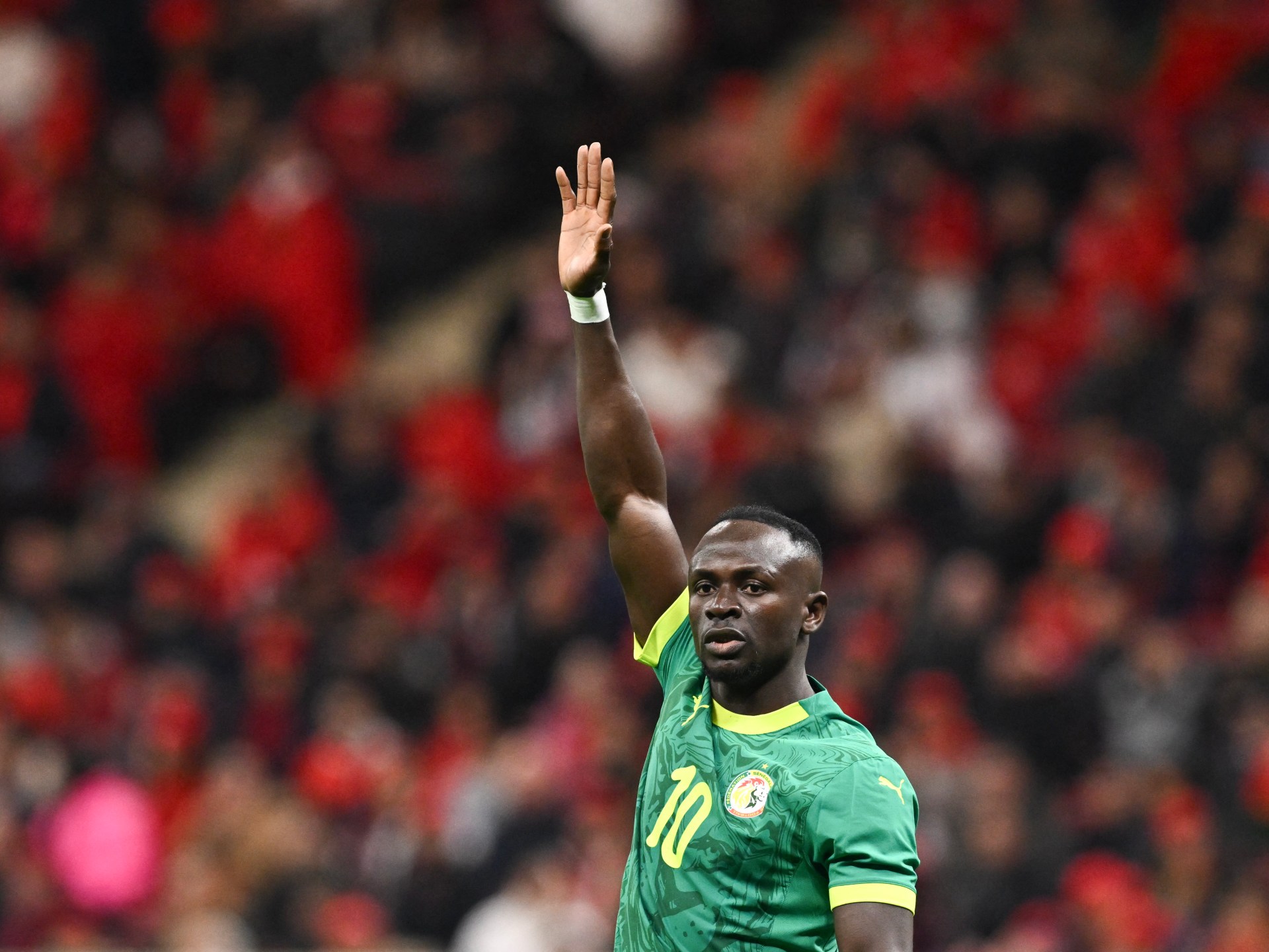 Senegal coach vows World Cup win, backed by rising national pride.