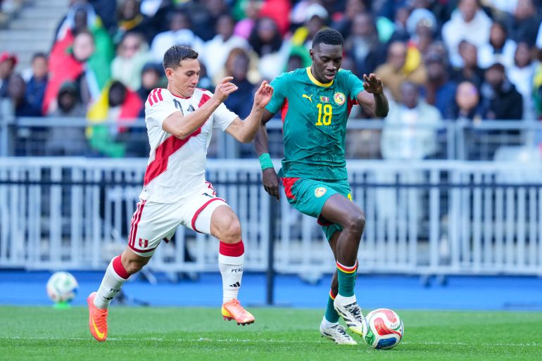 Senegal coach vows World Cup win, backed by rising national pride.