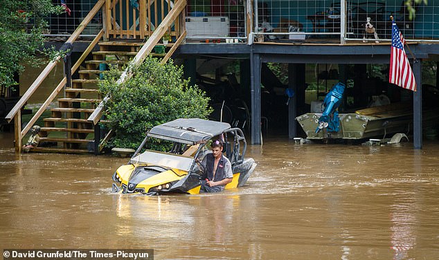 Tropical Storm Arthur brings deadly flooding to millions across eight states.