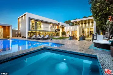 Young Man Arrested in Double Murder of American Idol Executive and Musician Husband: Evidence Indicates Prior Service Worker Visit to Victims' $5 Million Mansion